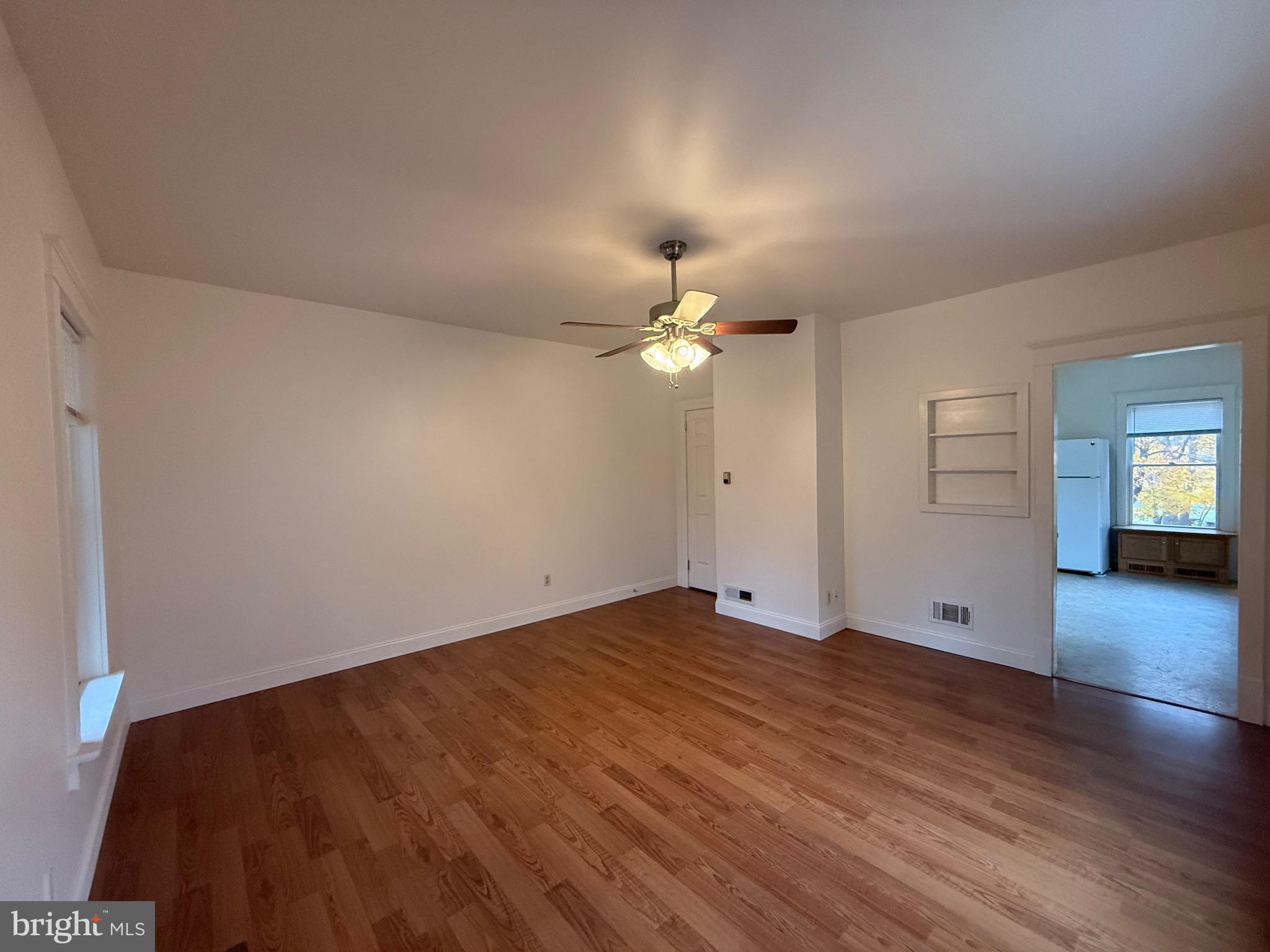 1740 Arnold Avenue Willow Grove, PA 19090 - Photo 5 of 22 a view of an empty room with window and wooden floor