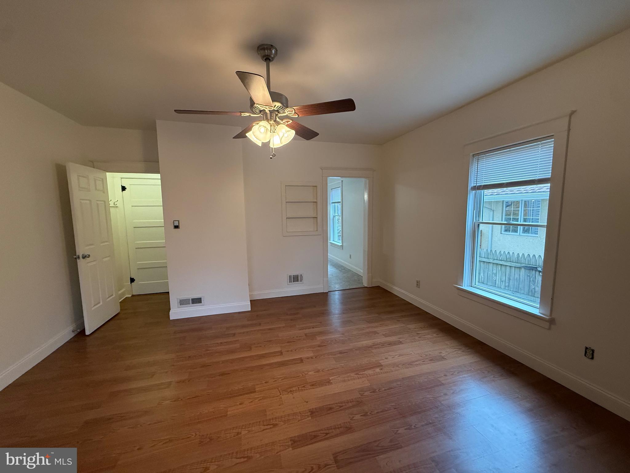 1740 Arnold Avenue Willow Grove, PA 19090 - Photo 6 of 22 a view of an empty room with a window and wooden floor