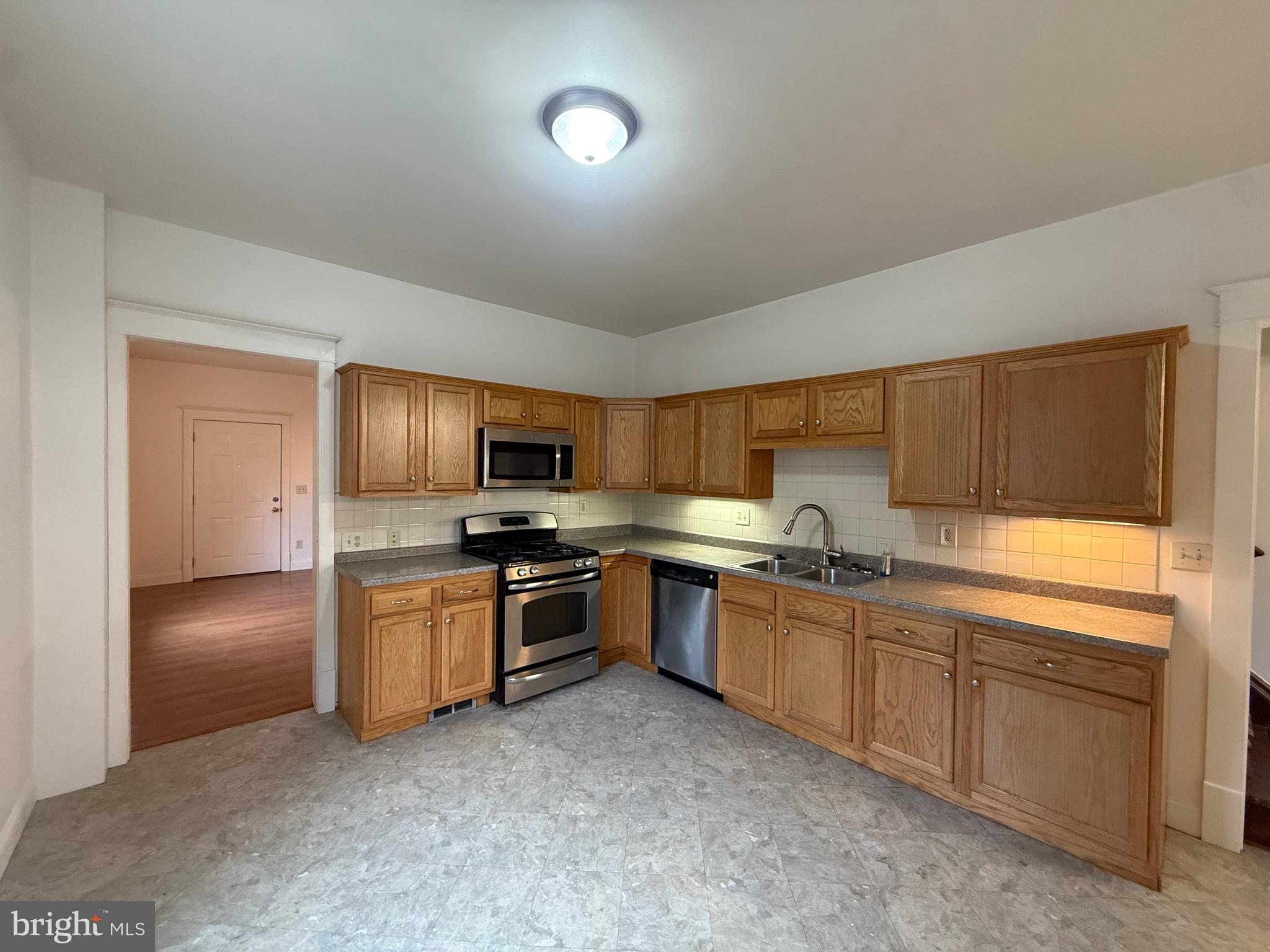 1740 Arnold Avenue Willow Grove, PA 19090 - Photo 7 of 22 a kitchen with granite countertop a sink and stainless steel appliances