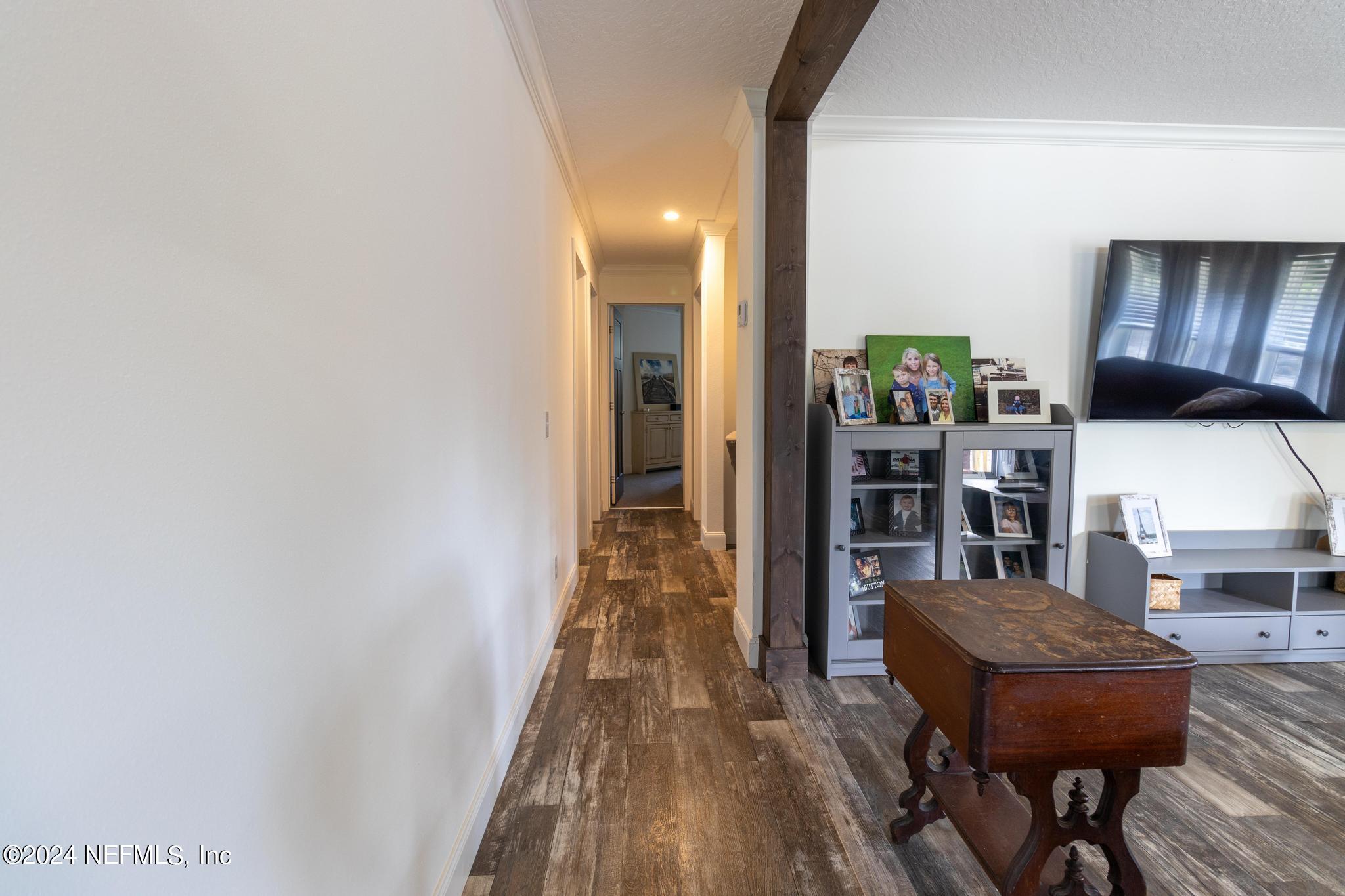 121 Honeysuckle Trail Hawthorne, FL 32640 - Photo 22 of 44 a view of a room with furniture and wooden floor