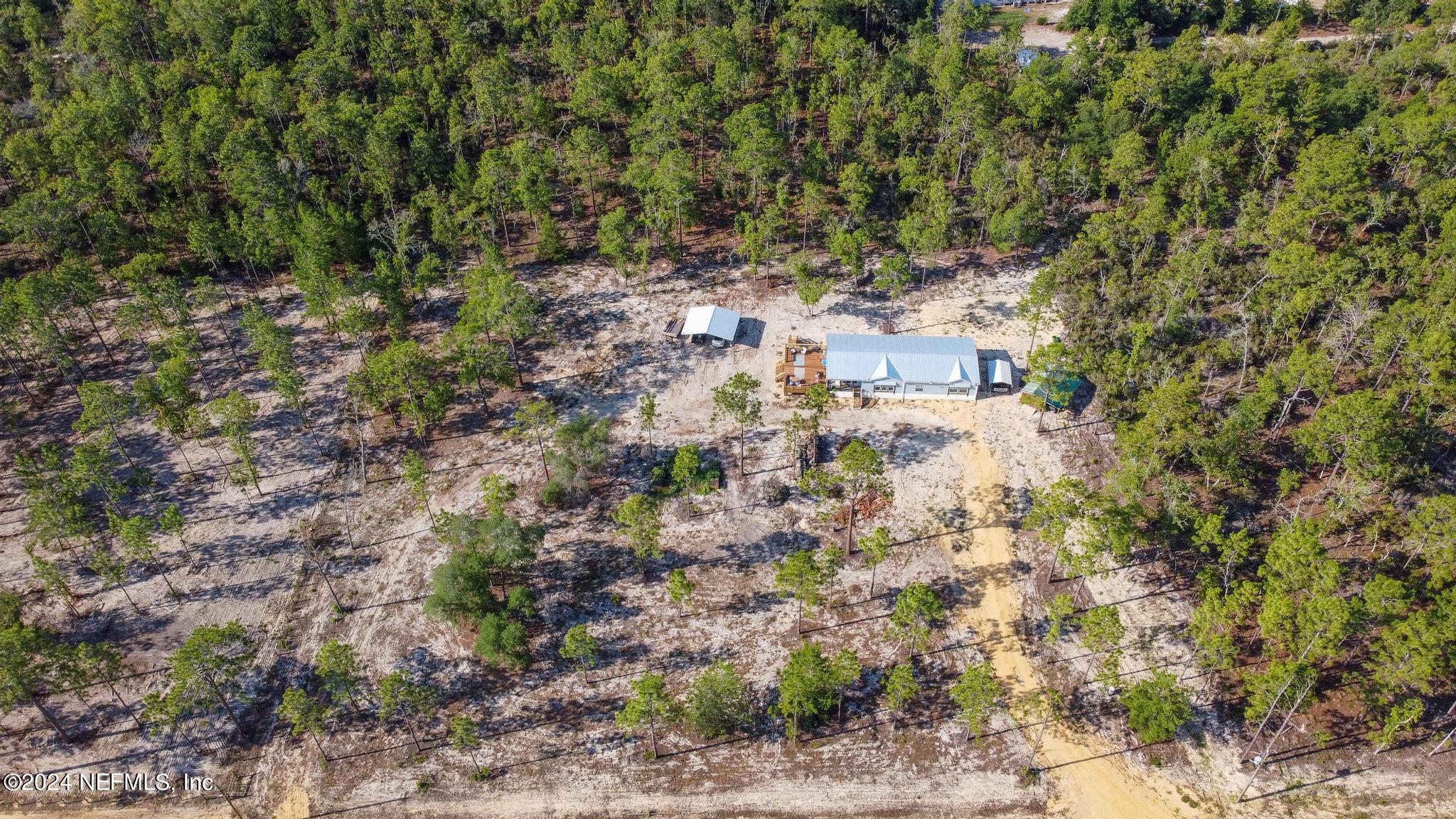 121 Honeysuckle Trail Hawthorne, FL 32640 - Photo 38 of 44 a view of residential houses with outdoor space