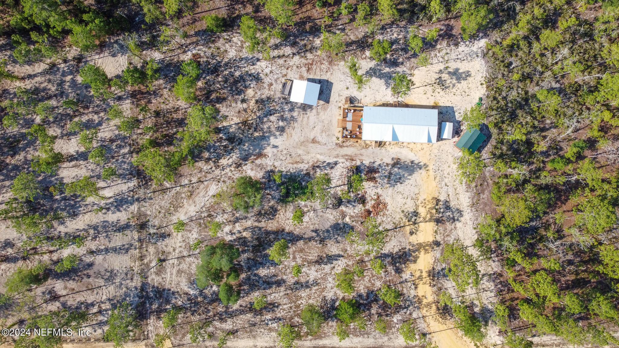 121 Honeysuckle Trail Hawthorne, FL 32640 - Photo 39 of 44 a front view of a house with a yard