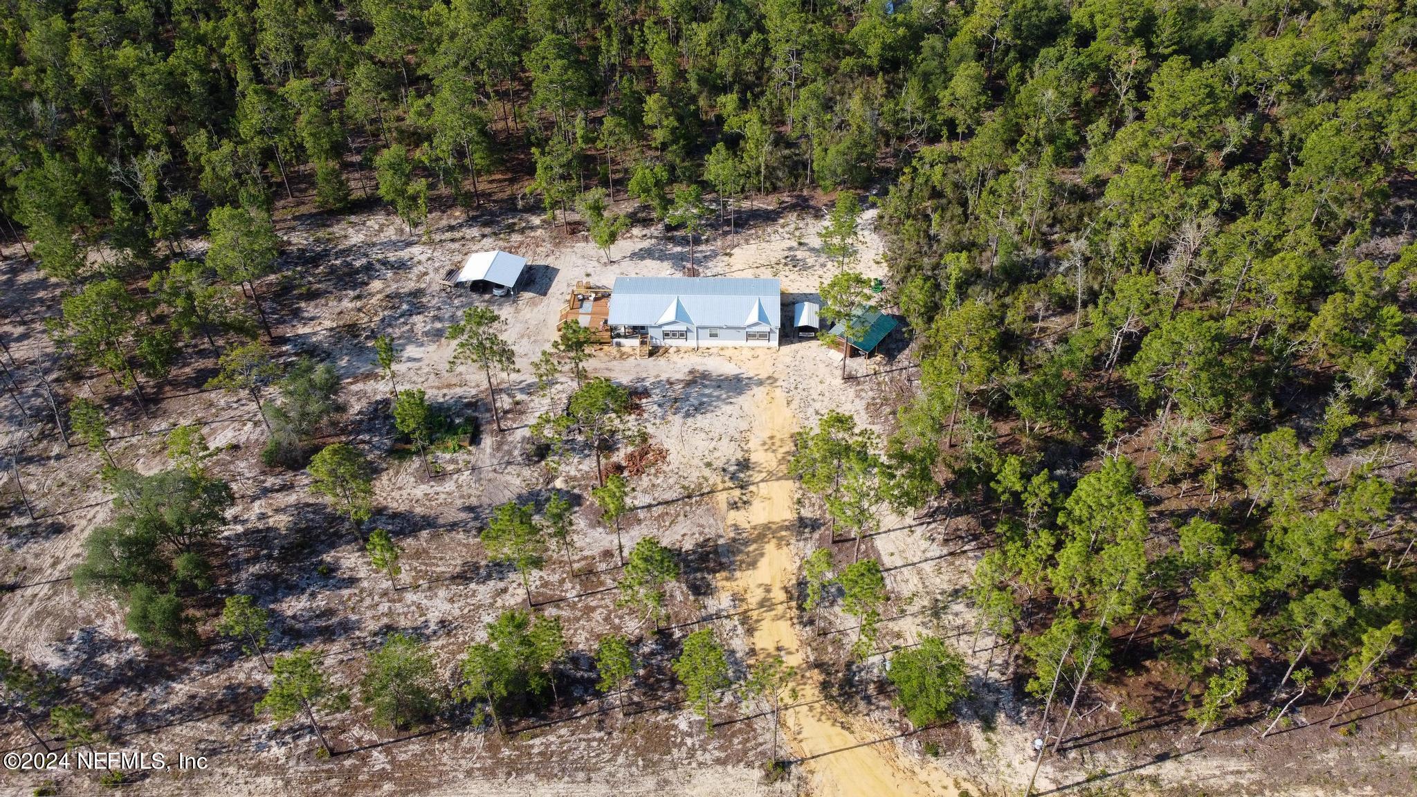 121 Honeysuckle Trail Hawthorne, FL 32640 - Photo 40 of 44 a view of cabinets and outdoor space