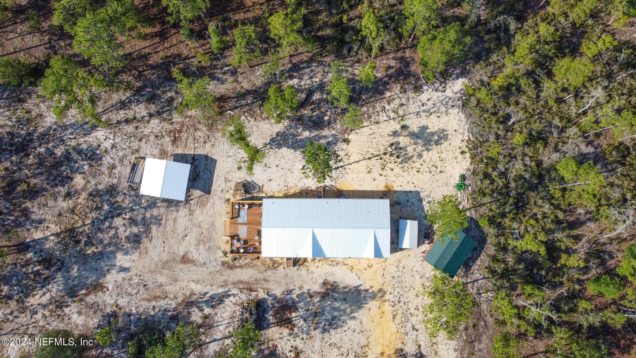 121 Honeysuckle Trail Hawthorne, FL 32640 - Photo 41 of 44 front view of a house with a yard
