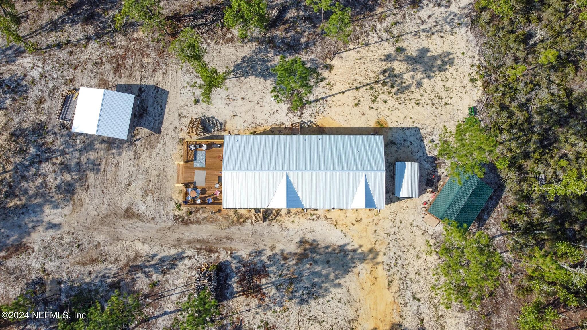 121 Honeysuckle Trail Hawthorne, FL 32640 - Photo 42 of 44 front view of a house with a yard