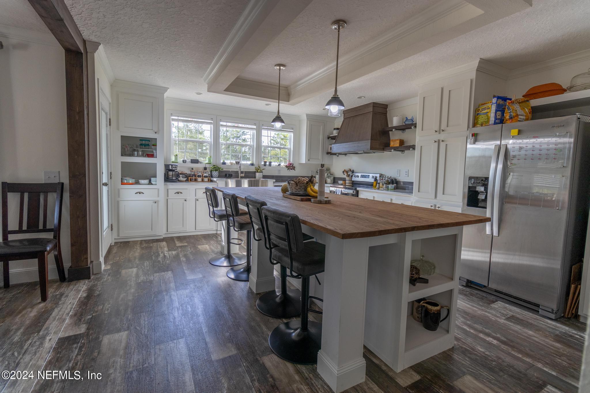121 Honeysuckle Trail Hawthorne, FL 32640 - Photo 7 of 44 a kitchen with refrigerator and window