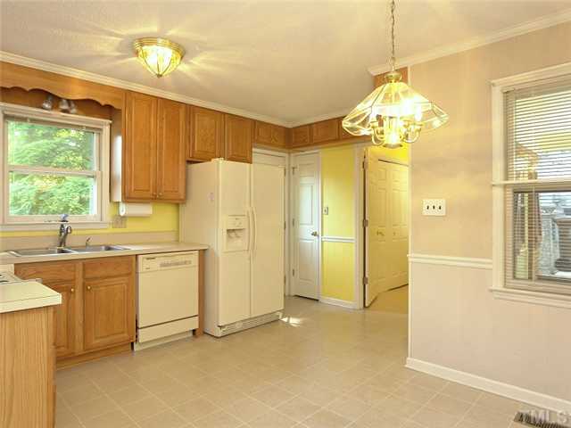 906 Belhaven Road Cary, NC 27513 - Photo 10 of 25 MORE CABINETS AND ENTRY INTO LAUNDRY ROOM