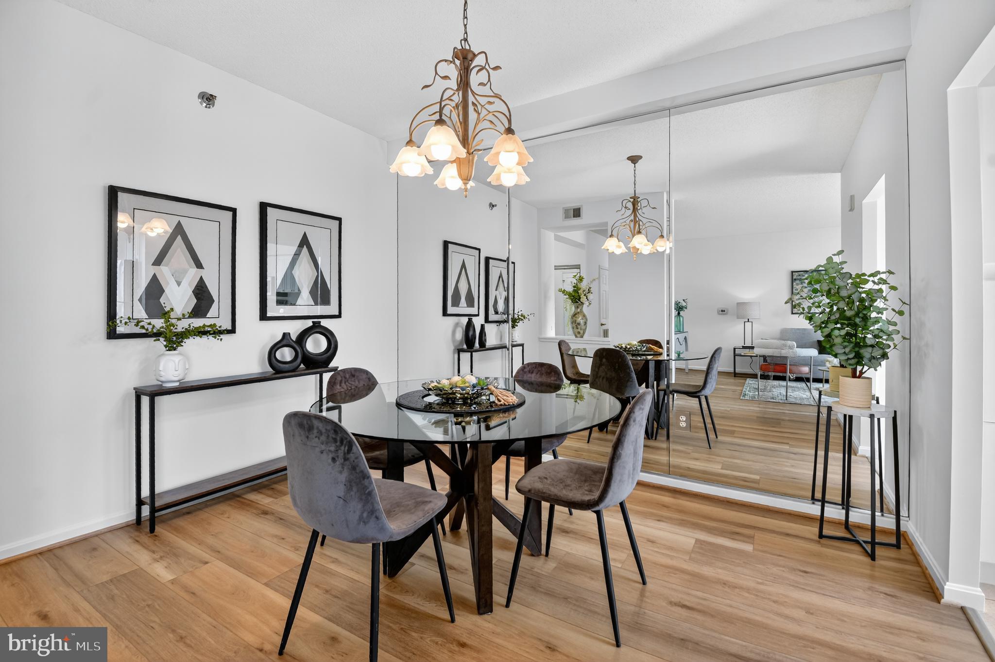 3005 South Leisure World Boulevard, Unit 426 Silver Spring, MD 20906 - Photo 13 of 45 a view of a a dining room with furniture window and wooden floor