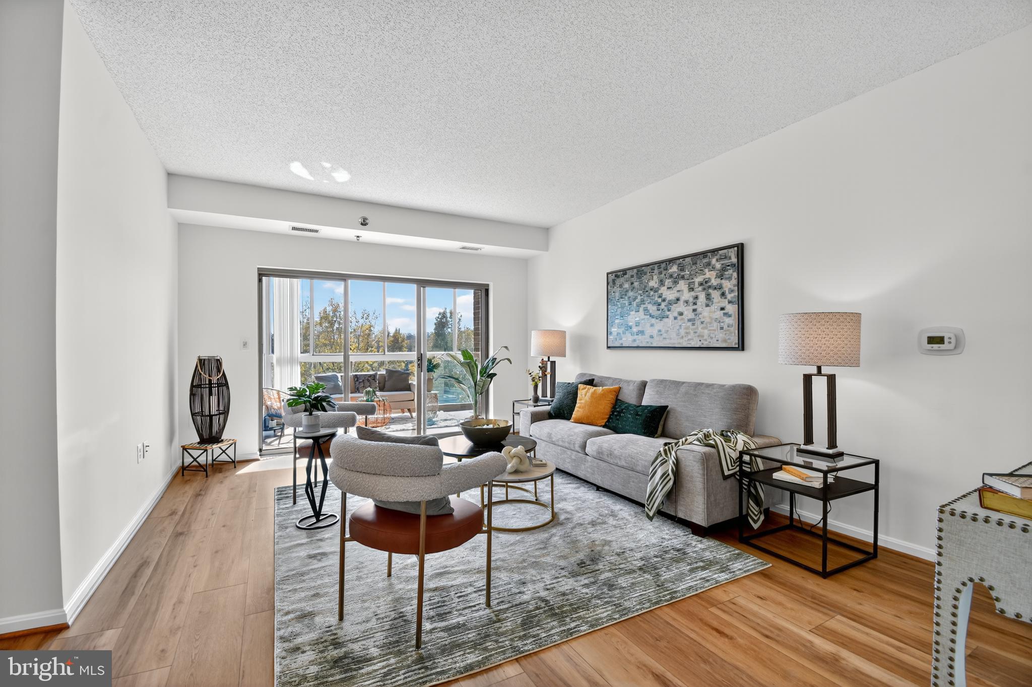 3005 South Leisure World Boulevard, Unit 426 Silver Spring, MD 20906 - Photo 15 of 45 a living room with furniture and a large window
