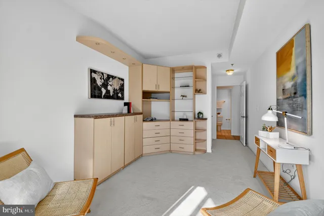 a bedroom with furniture and a gate