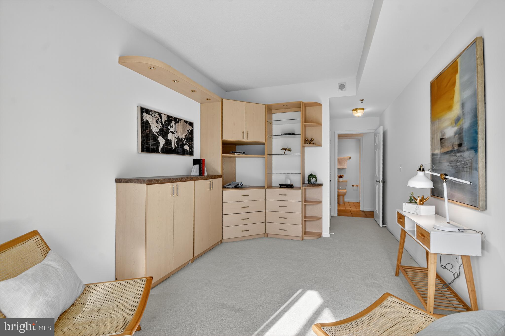 3005 South Leisure World Boulevard, Unit 426 Silver Spring, MD 20906 - Photo 19 of 45 a bedroom with furniture and a gate