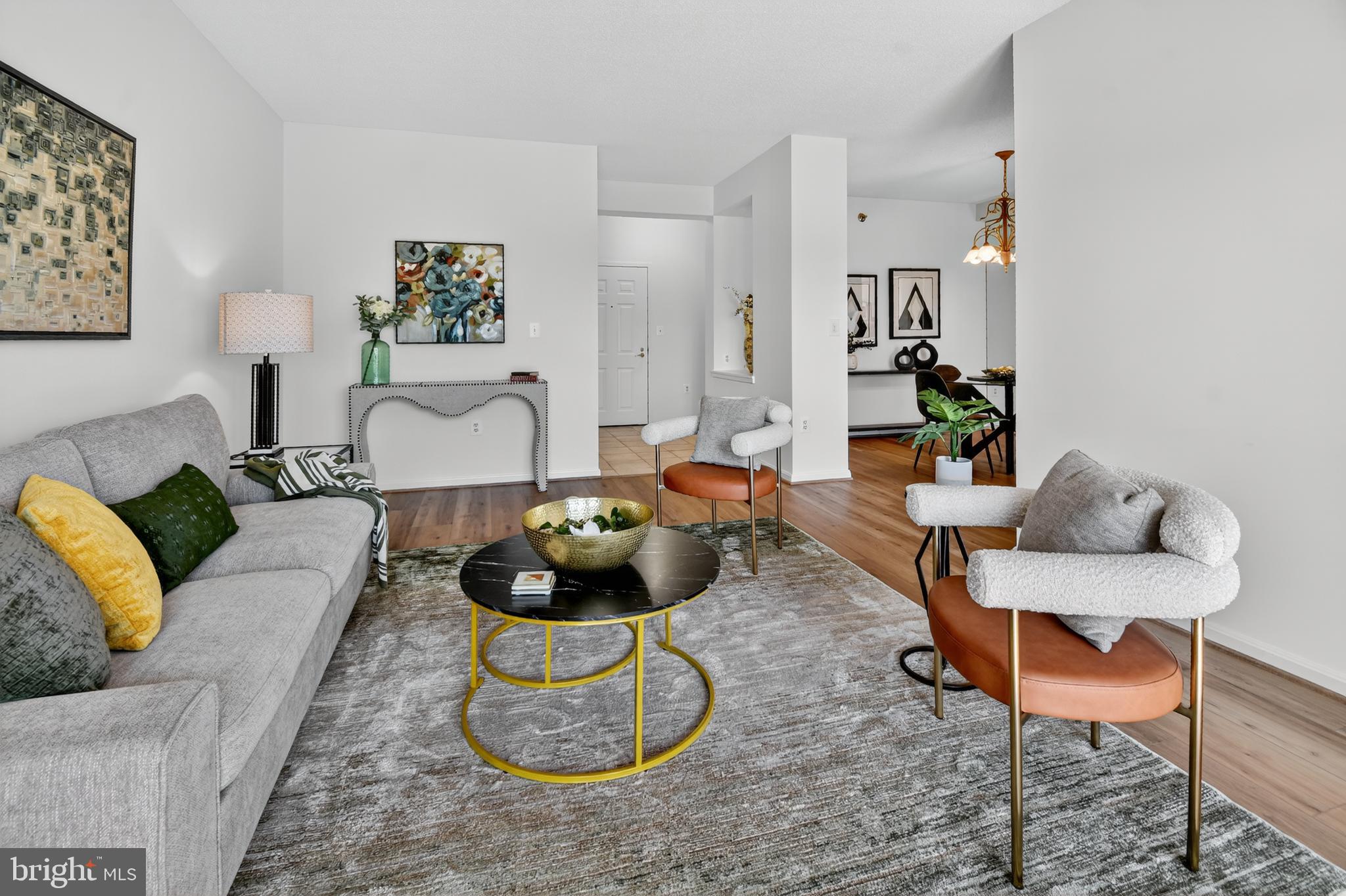 3005 South Leisure World Boulevard, Unit 426 Silver Spring, MD 20906 - Photo 20 of 45 a living room with furniture and wooden floor