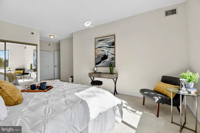 a bedroom with a bed and furniture