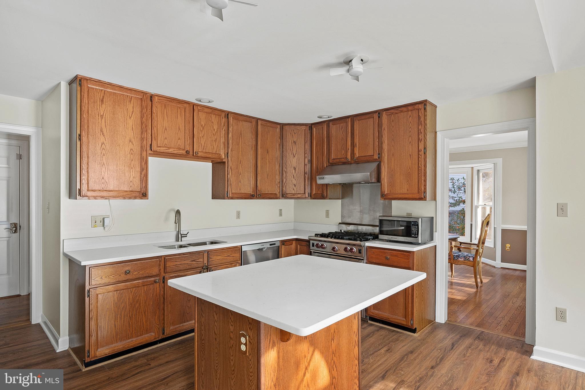 13808 Pleasant View Drive Bowie, MD 20720 - Photo 16 of 46 a kitchen with a sink stove and cabinets