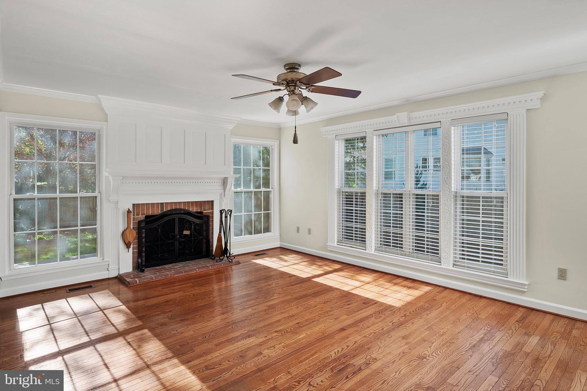 13808 Pleasant View Drive Bowie, MD 20720 - Photo 20 of 46 a view of empty room with fireplace and windows