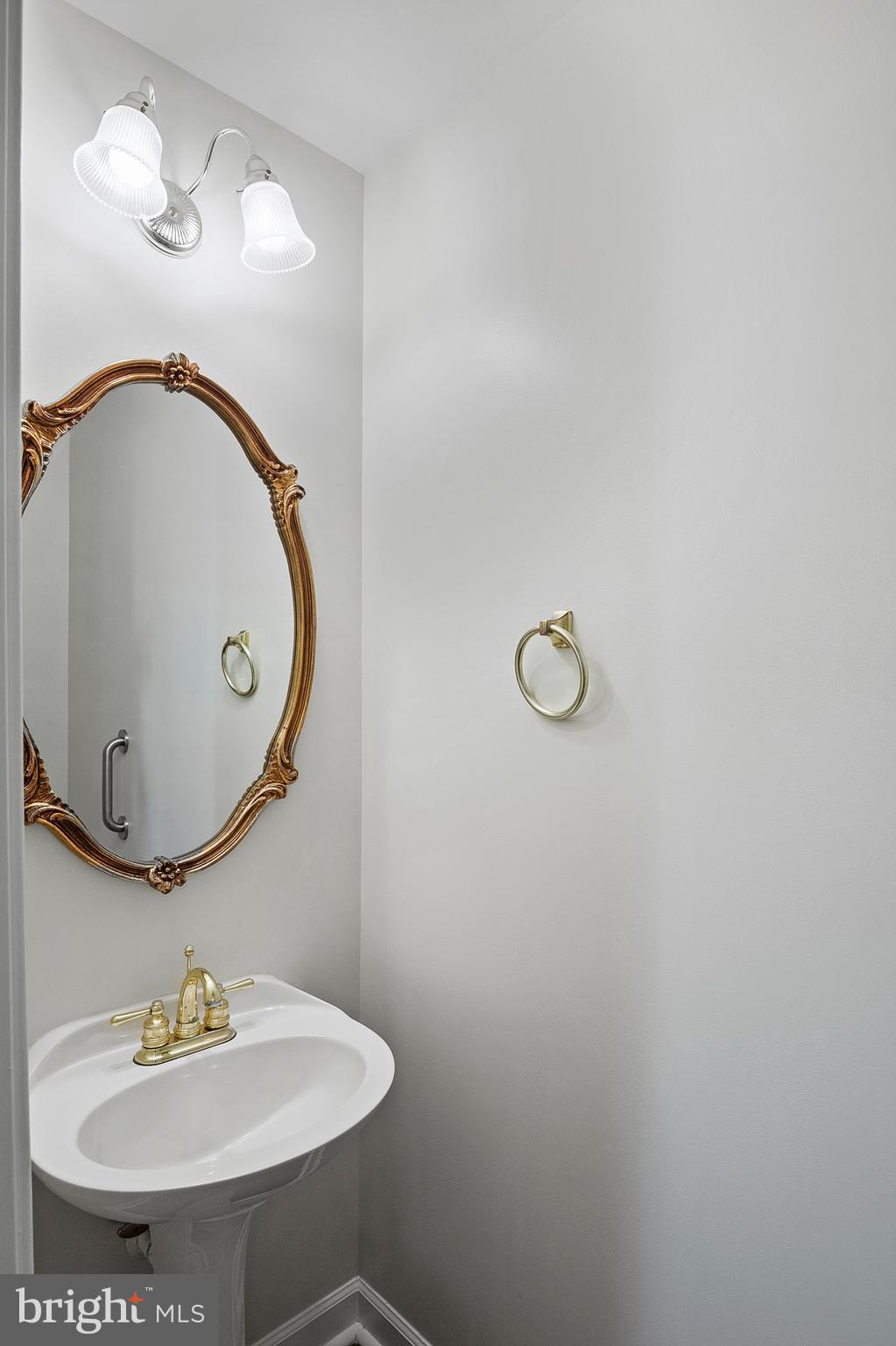 13808 Pleasant View Drive Bowie, MD 20720 - Photo 22 of 46 a bathroom with a sink and mirror