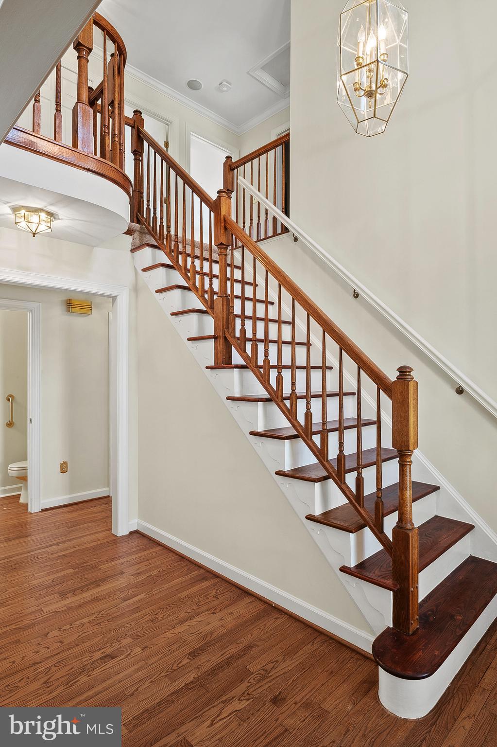 13808 Pleasant View Drive Bowie, MD 20720 - Photo 23 of 46 a view of staircase with wooden floor and white walls