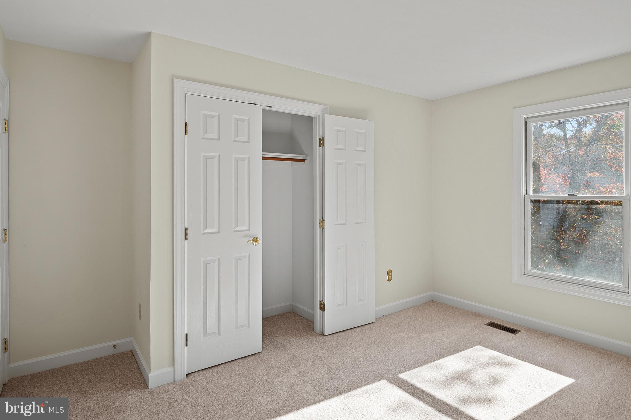 13808 Pleasant View Drive Bowie, MD 20720 - Photo 35 of 46 a view of an empty room with window and wooden floor