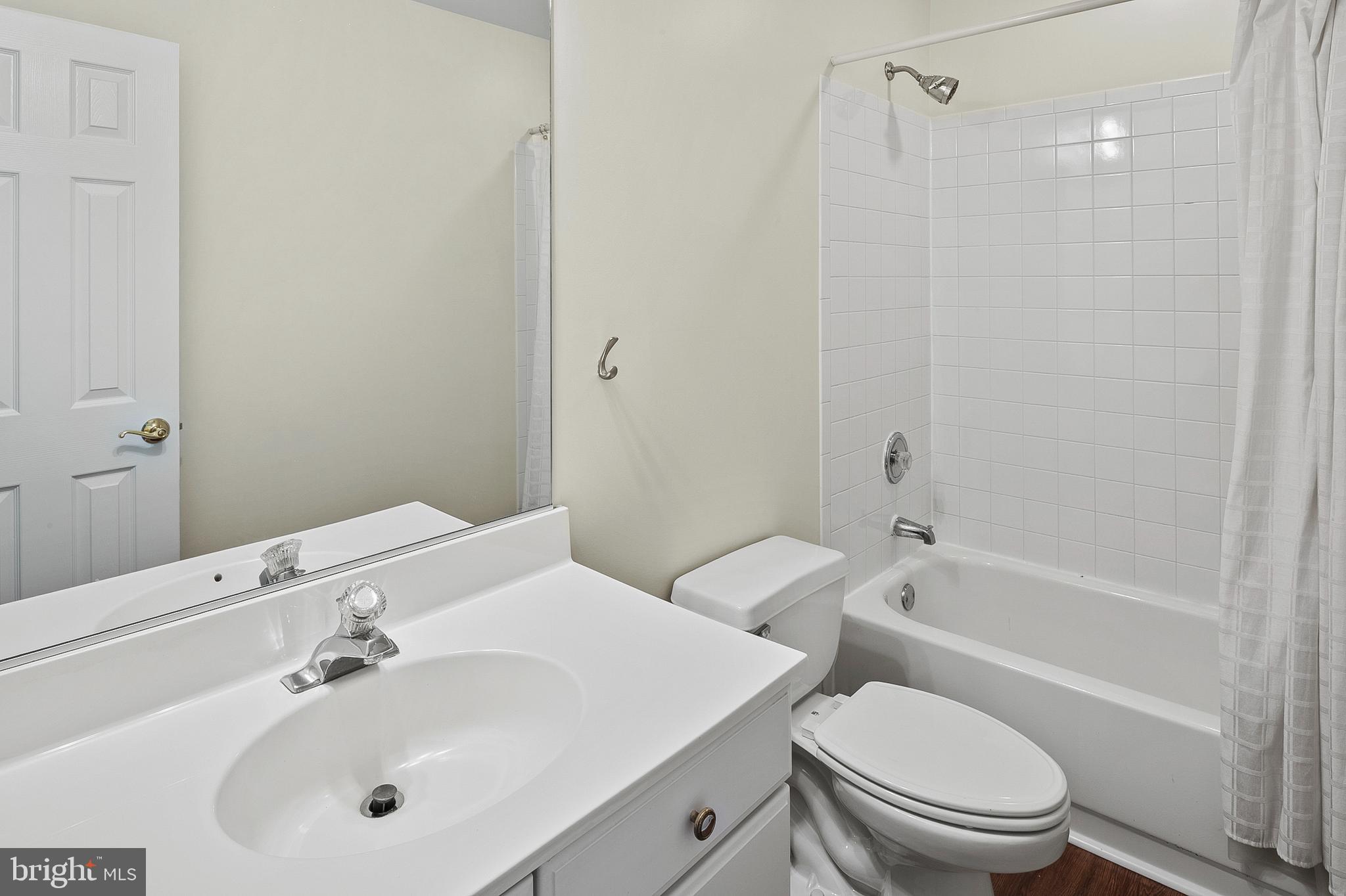 13808 Pleasant View Drive Bowie, MD 20720 - Photo 37 of 46 a bathroom with a sink toilet and shower