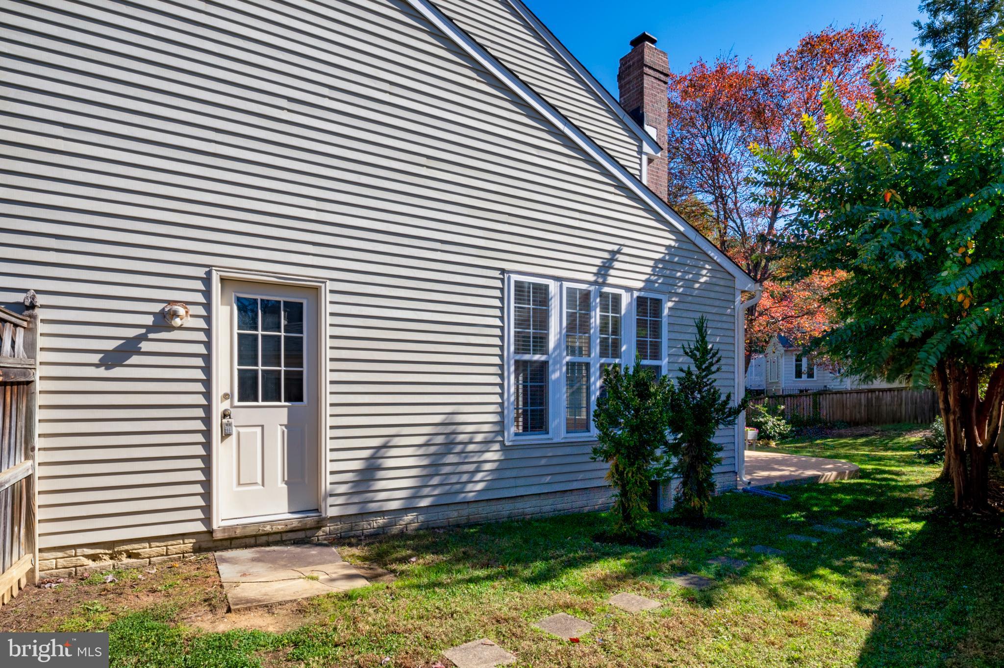 13808 Pleasant View Drive Bowie, MD 20720 - Photo 41 of 46 a view of a house with a yard and plants
