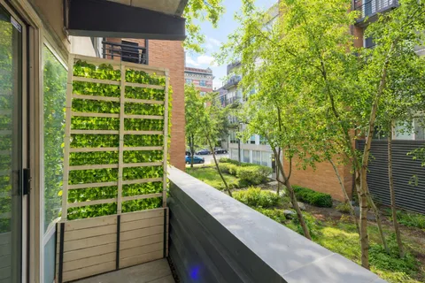 a view of a garden from a balcony