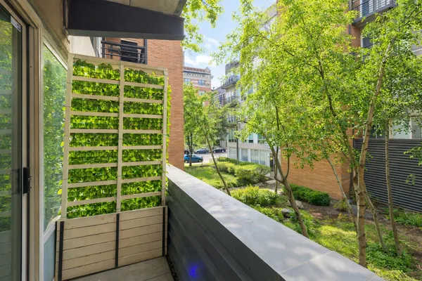 a view of a garden from a balcony