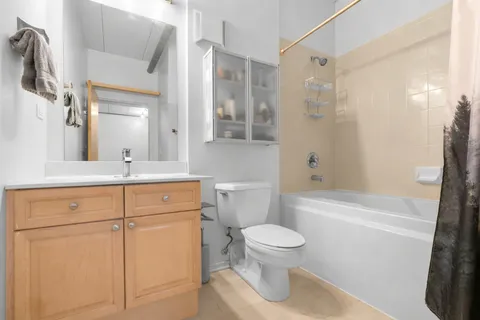 a bathroom with a sink a toilet and a bathtub