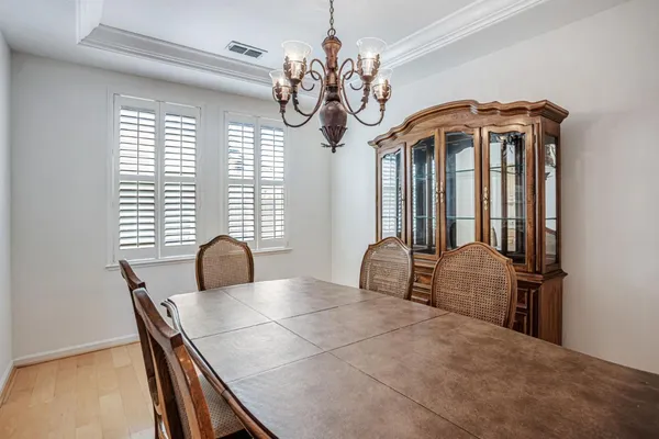 a bedroom with furniture and a flat screen tv