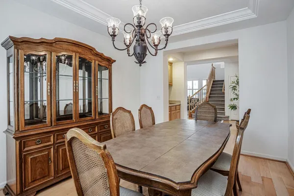 a living room with furniture and a piano