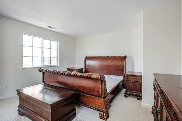 a view of an empty room and closet area