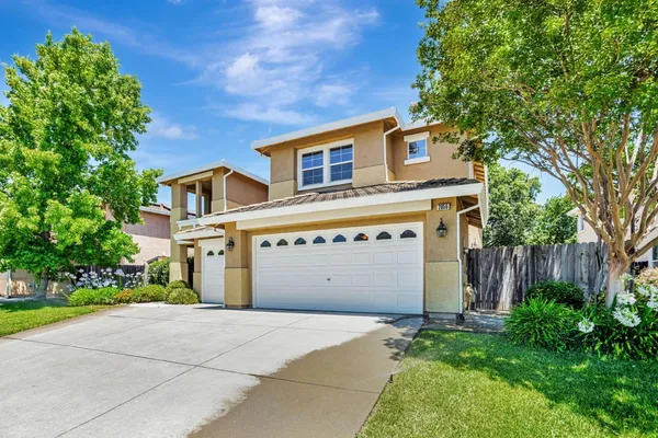 a view of a kitchen with cabinets and wooden floor