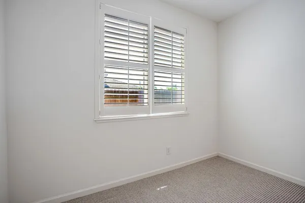 a bathroom with a sink double vanity and a mirror