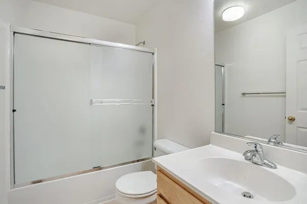 a front view of a house with glass windows