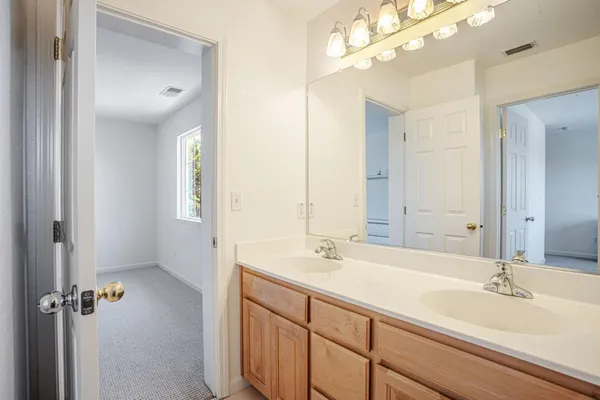 an aerial view of residential houses with outdoor space and lake view