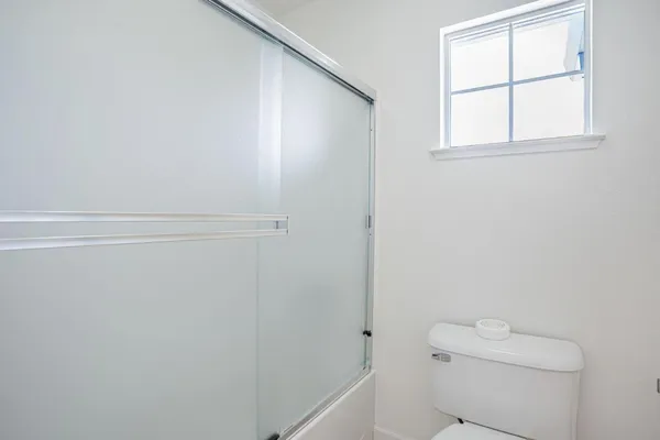 an aerial view of residential houses with outdoor space and lake view