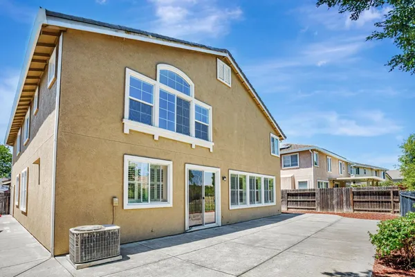 an aerial view of residential house with outdoor space and lake view