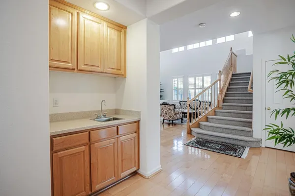 a view of empty room with a fireplace and window