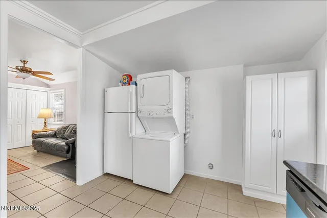a white refrigerator freezer and a stove sitting inside of a kitchen