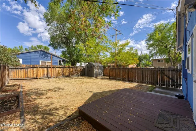 a view of a backyard with wooden floor