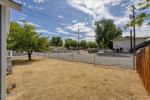 a view of a street with a building in the background