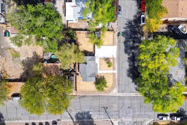 an aerial view of a house with a yard and garden