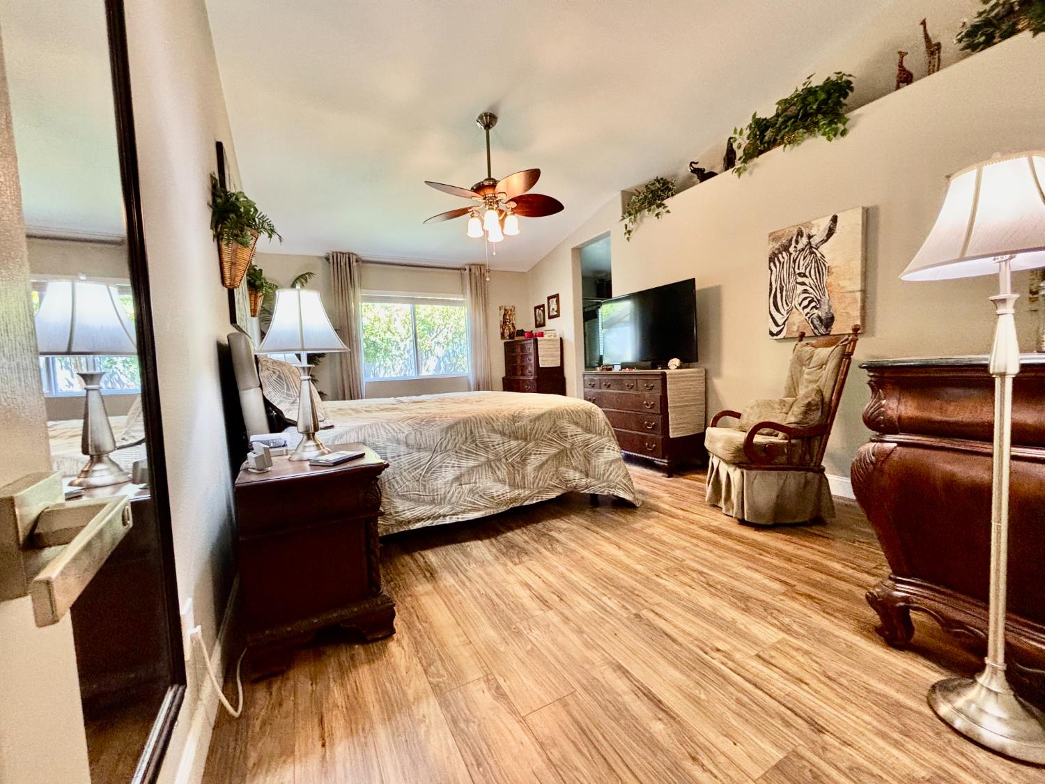 111 McCurry Street Wheatland, CA 95692 - Photo 27 of 55 a bedroom with a bed and wooden floor