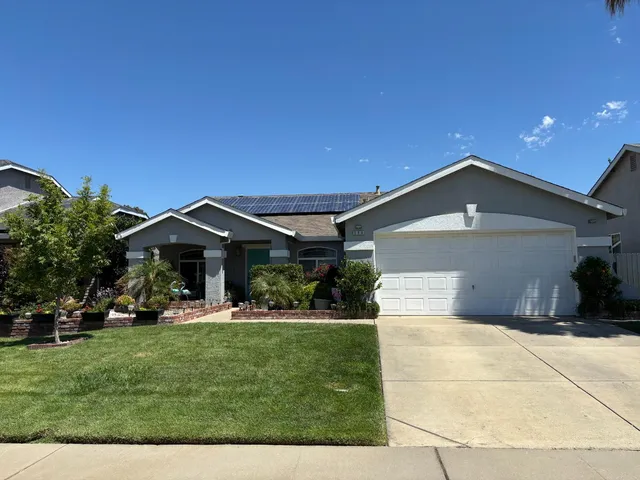 a bedroom with a bed window and couch