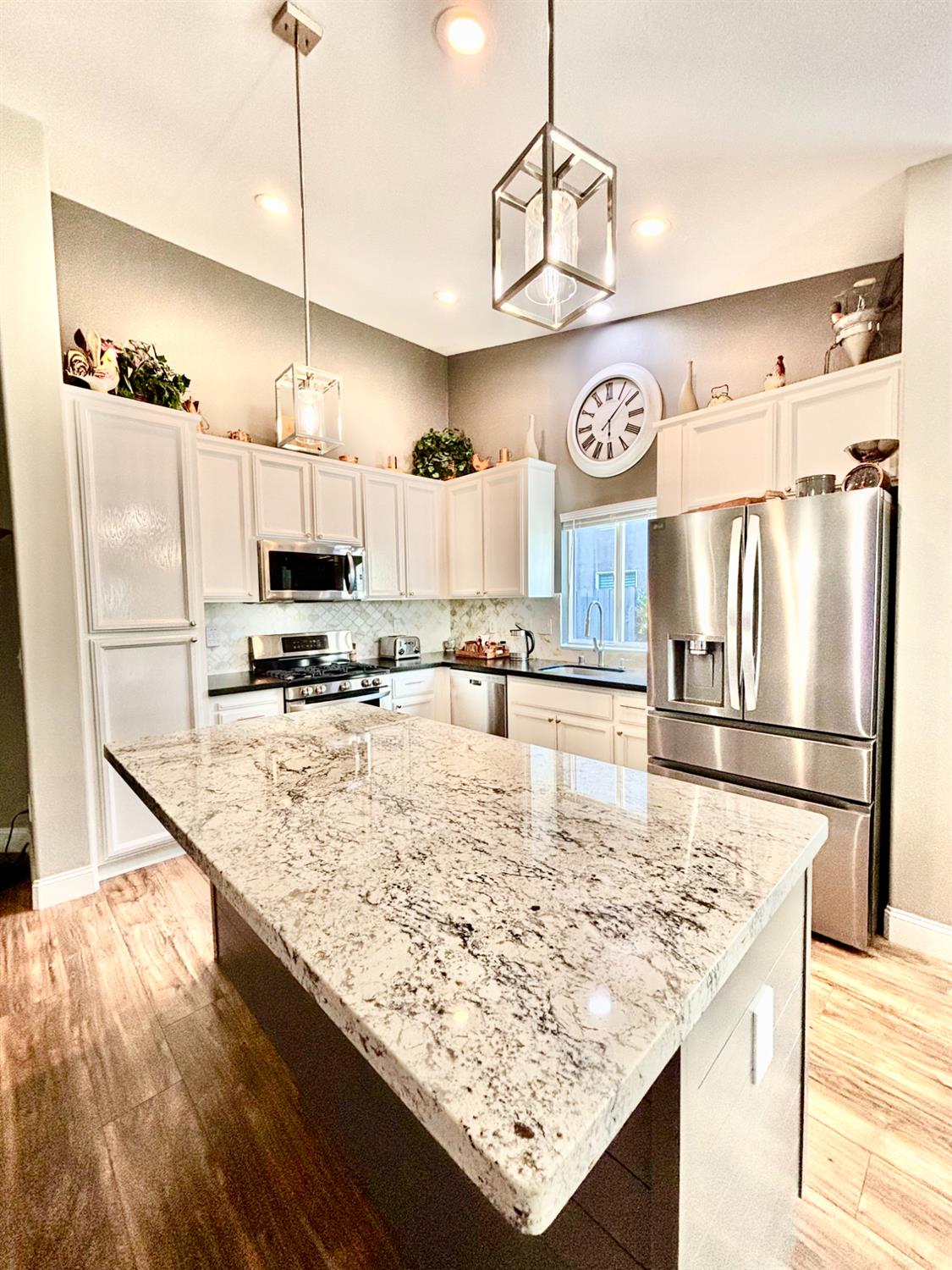 111 McCurry Street Wheatland, CA 95692 - Photo 9 of 55 a view of a kitchen with stainless steel appliances granite countertop a sink refrigerator and microwave