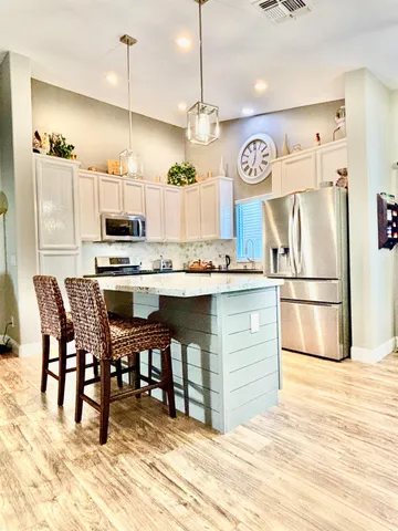 a view of a chairs and table in the patio