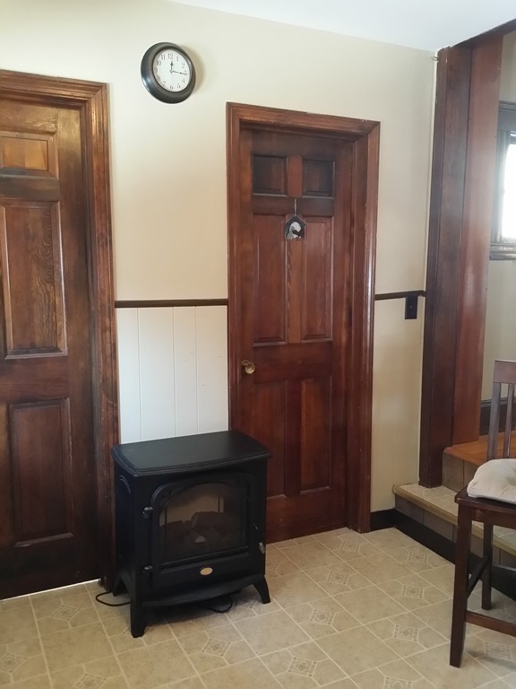 11 Linwood Road Lynn, MA 01905 - Photo 15 of 23 a living room with a bed and a dresser