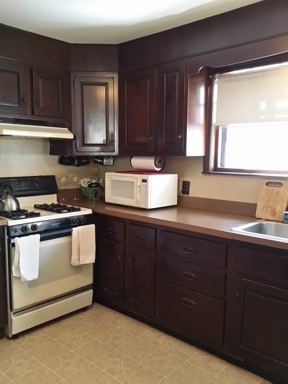 11 Linwood Road Lynn, MA 01905 - Photo 3 of 23 a kitchen with a sink and a stove