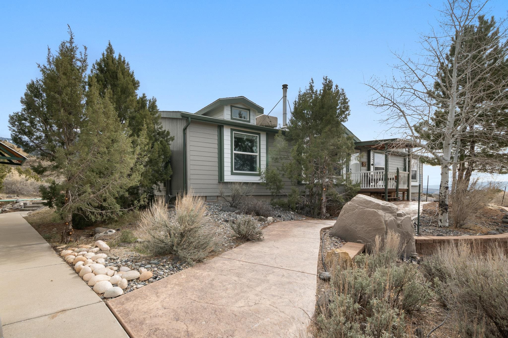3984 Rapid Creek Road Palisade, CO 81526 - Photo 1 of 30 a front view of a house with garden