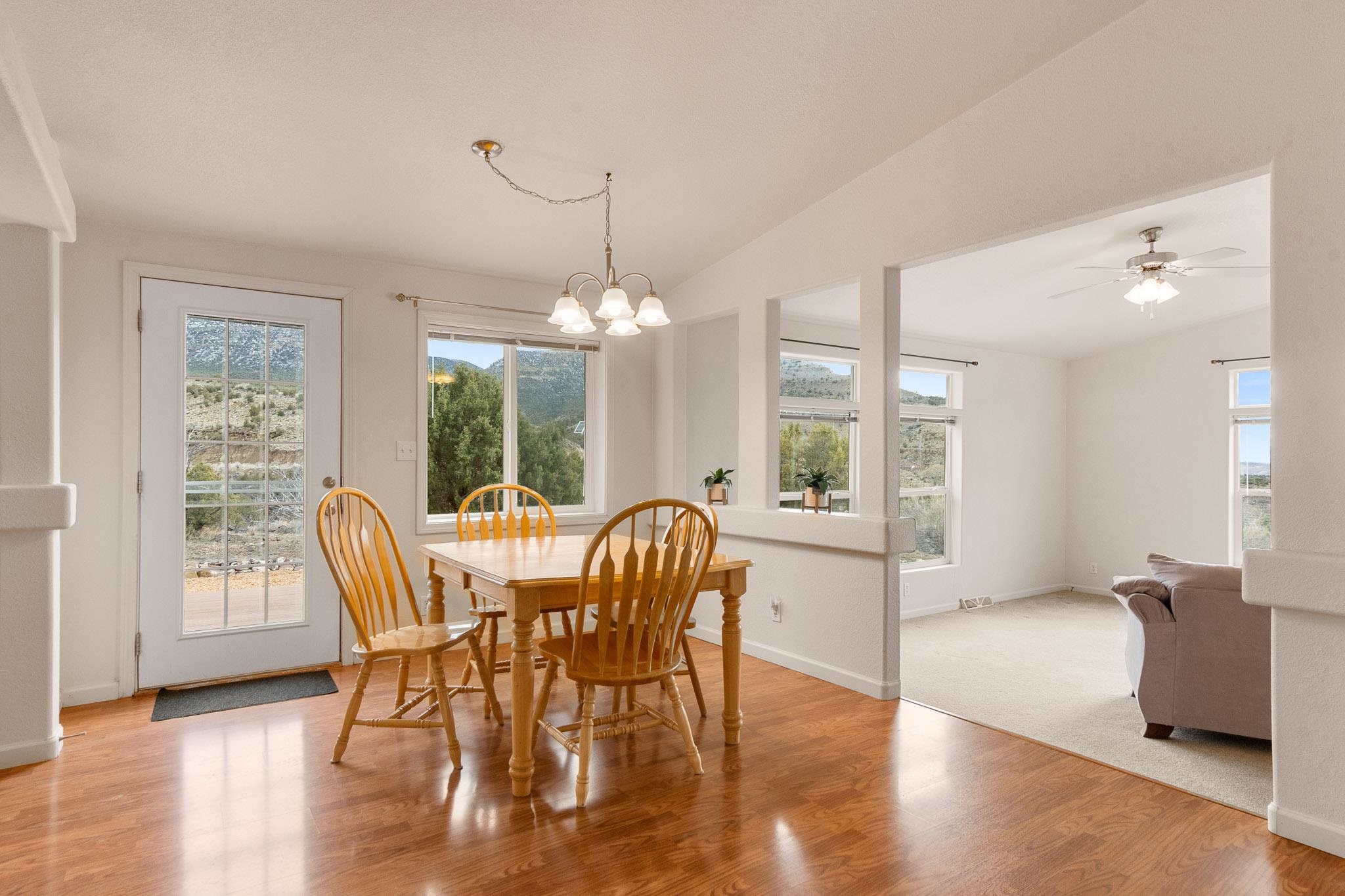 3984 Rapid Creek Road Palisade, CO 81526 - Photo 11 of 30 a view of a dining room with furniture window and wooden floor