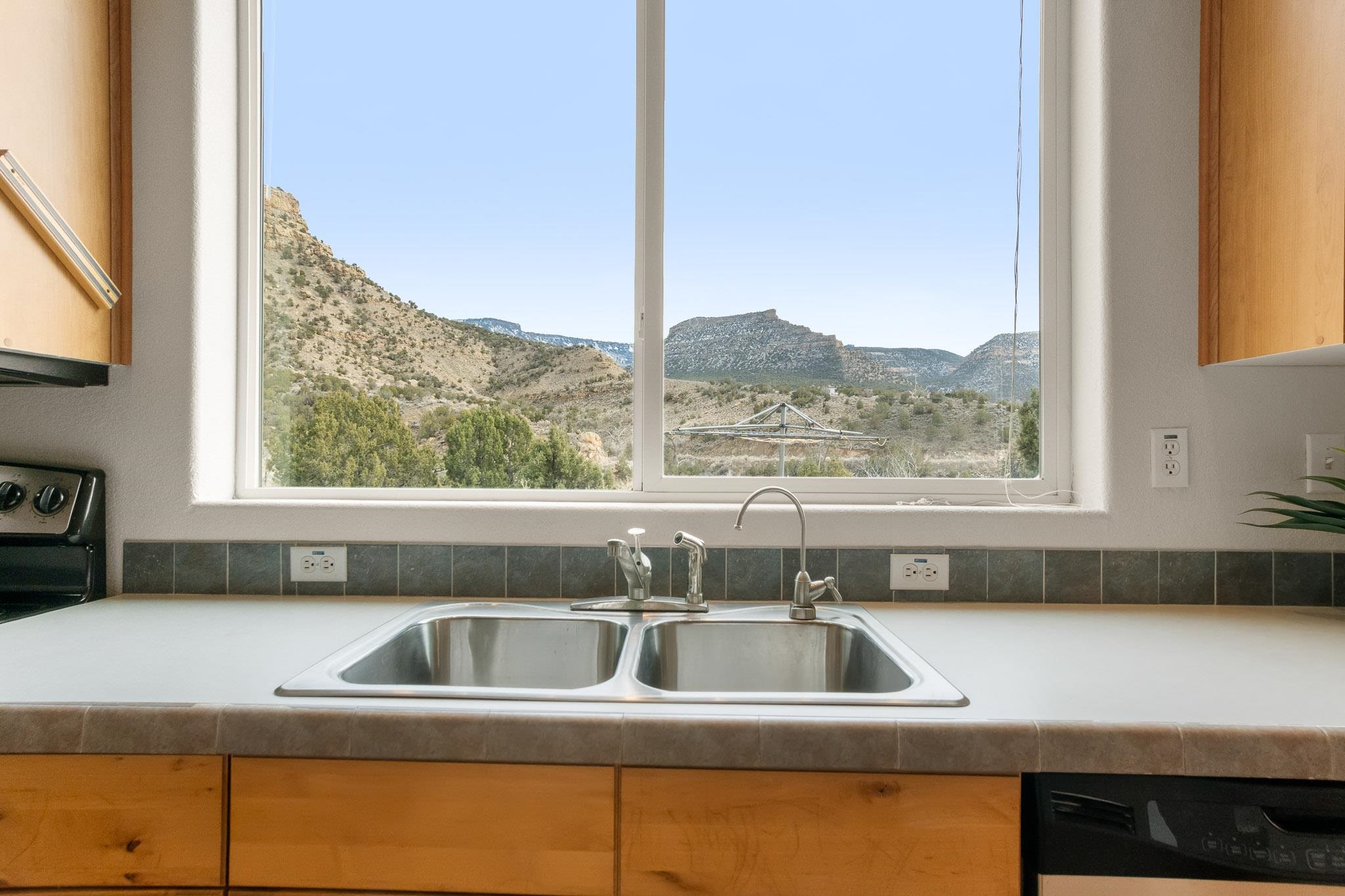 3984 Rapid Creek Road Palisade, CO 81526 - Photo 12 of 30 a kitchen with a sink and a window